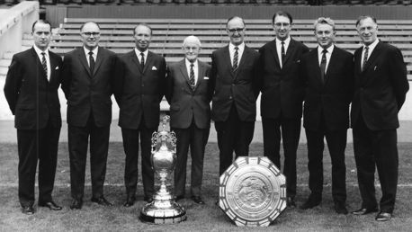 TRUE BLUE: Eric Alexander is pictured second right next to Joe Mercer and City's directors following our 1968 league title and Charity Shield triumphs