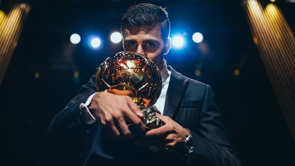 TOP TROPHY : Rodri kisses the Ballon d’Or at the Theatre du Chatelet in Paris after becoming the first Man City player to win the coveted award.