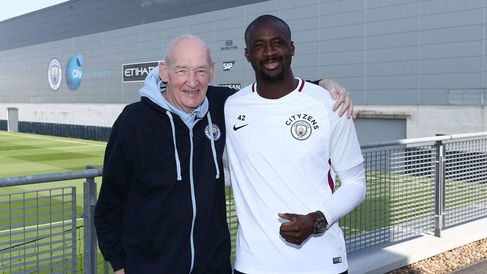 WARM EMBRACE : Bernard shares a smile with former City midfield powerhouse Yaya Toure