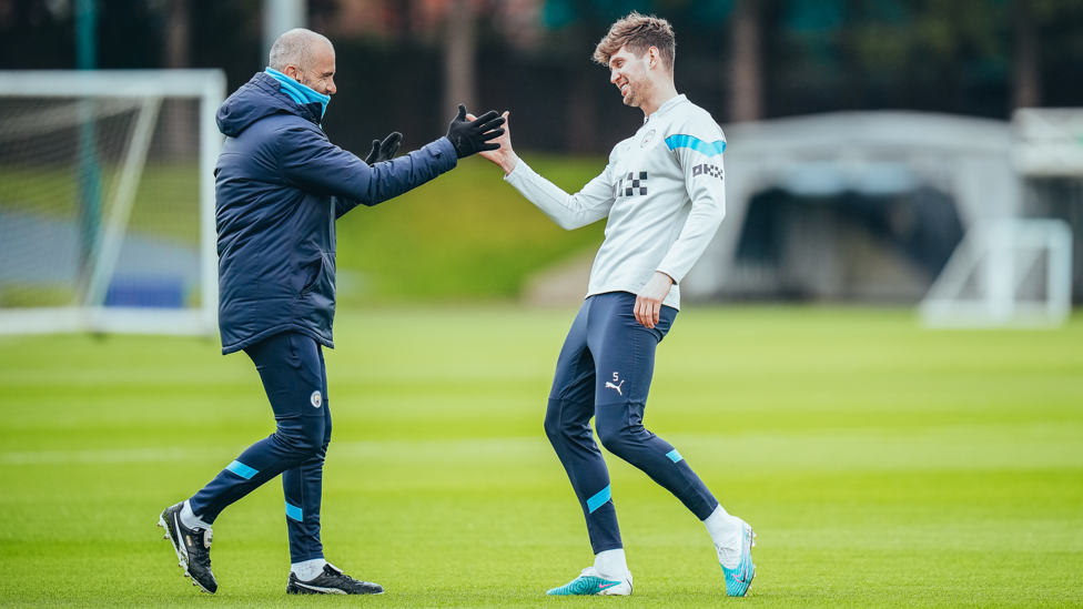 WELCOME BACK : Enzo Maresca shakes hands with the returning John Stones