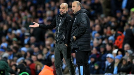 TALKING TACTICS: Pep Guardiola and Rodolfo Borrell watch on against Leicester.