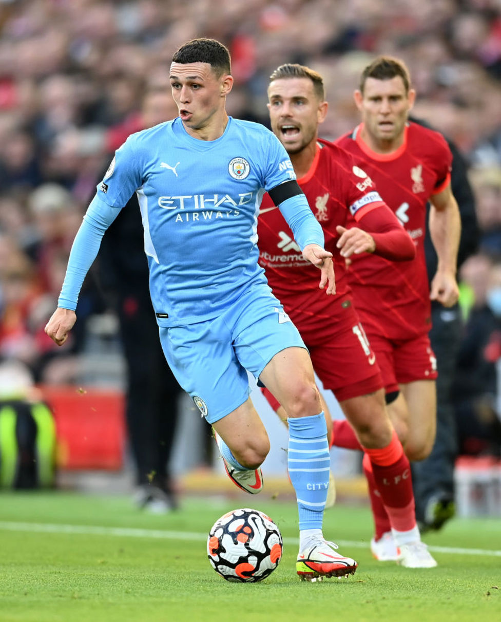 PHIL-ING IT : Foden bursts away from Henderson.