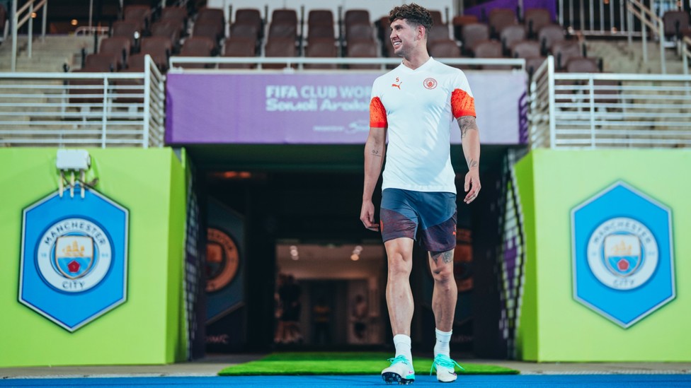 SETTLING IN : John Stones heads out to the training pitch