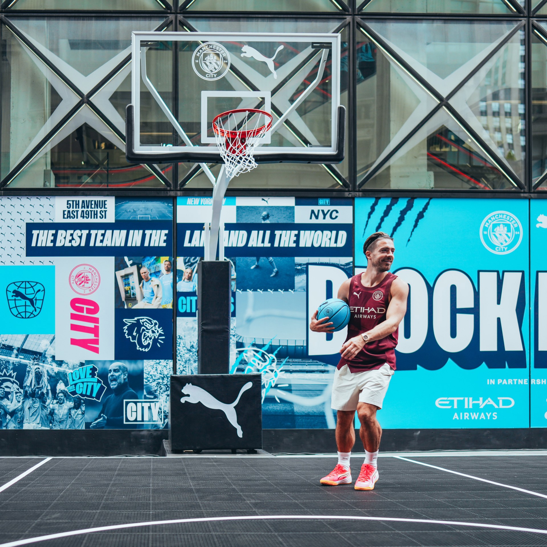 Man City star beam as he plays street basketball in New York in special outfit