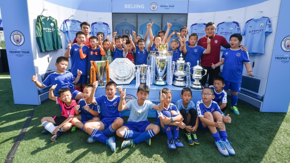 TROPHY LADEN : A photo to treasure for a group of Beijing youngsters.