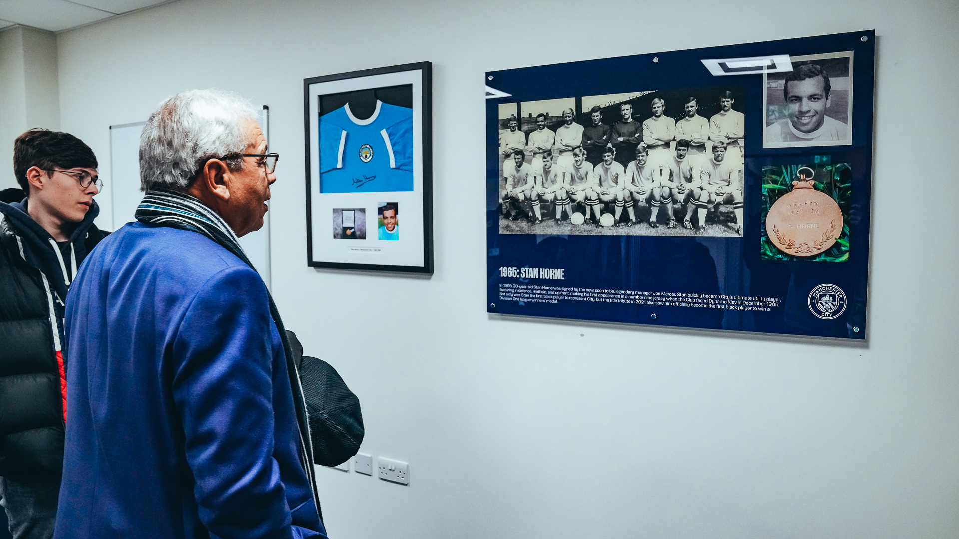 SPECIAL MEMORIES: Stan looks at a team picture from his time at City.