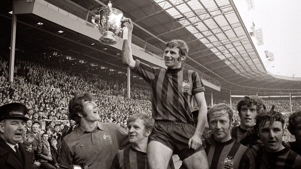 LEAGUE CUP IN THE CABINET : City captain Tony Book sits on the shoulders of his teammates during celebrations after the1970 League Cup final win over West Brom