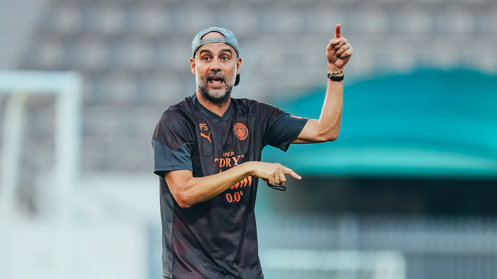 THIS WAY OR THAT WAY? : Pep Guardiola giving the orders in training