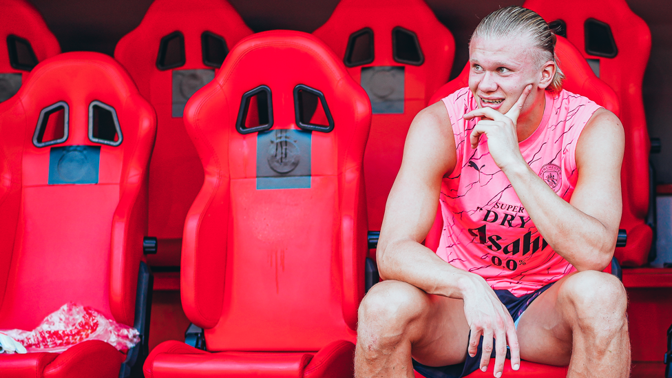 THE DUGOUT : Erling Haaland checking out the view from the manager's seat.