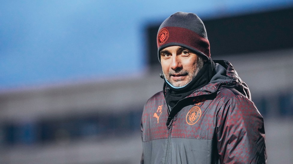 WRAPPED UP WARM : Pep Guardiola isn't thrilled with the chilly weather in Manchester.