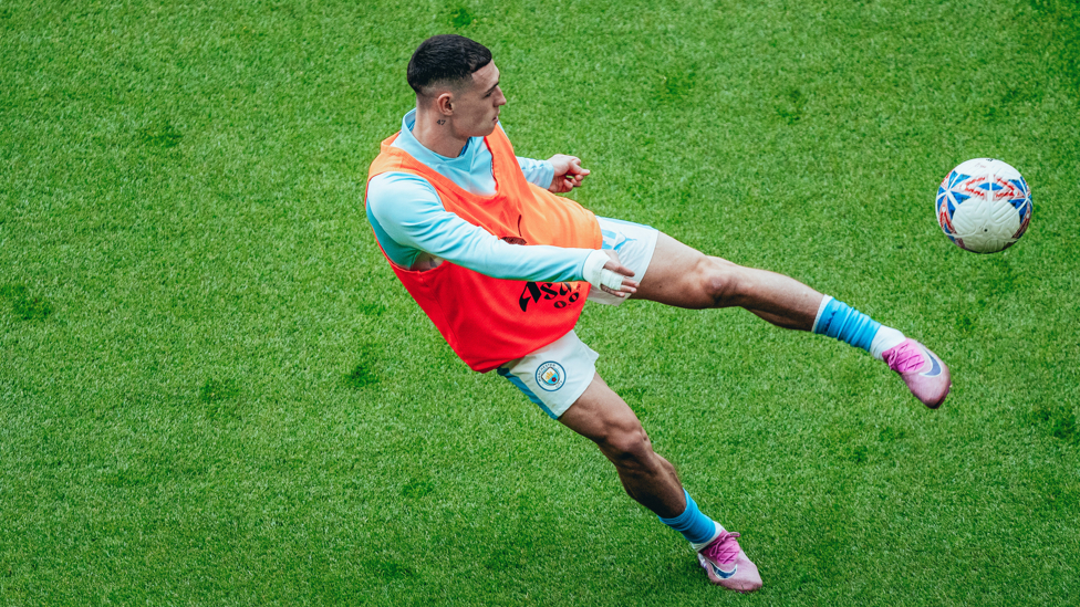 PHIL-ING GOOD : Foden gets in the mood during the pre-match warm up.