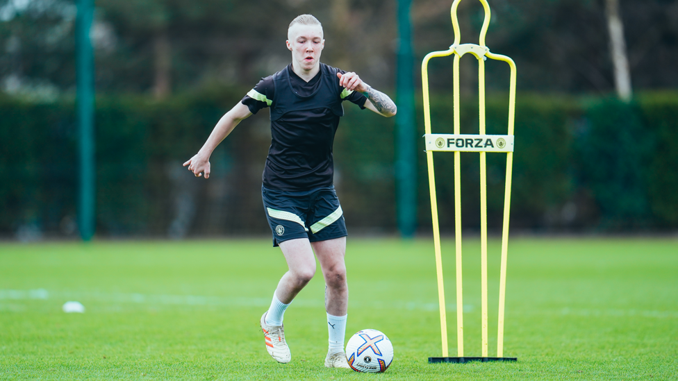 PUTTING IN THE GRAFT : Alfie Harrison gets a touch of the ball