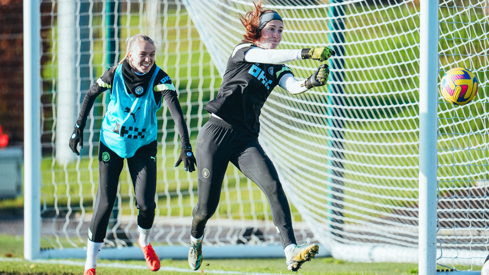 NO NONSENSE: Keeper Sandy MacIver punches a cross clear