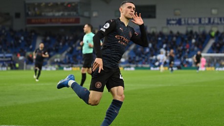 BABY SHARK: Foden wheels away to celebrate his stunning goal.