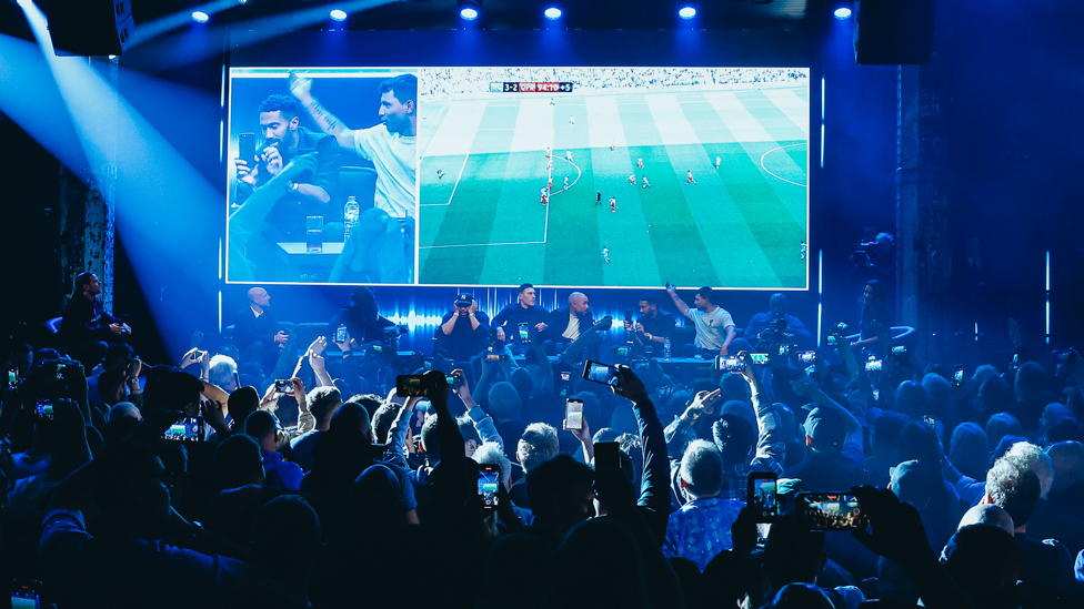 REMINISCING : Players and fans watch as that Aguero goal goes in