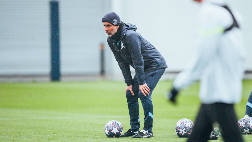 A DIFFERENT ANGLE : Pep Guardiola gets a closer look at things