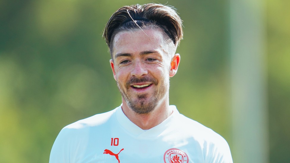 JOLLY JACK: Winger Jack Grealish shares a smiles ahead of the next drill.