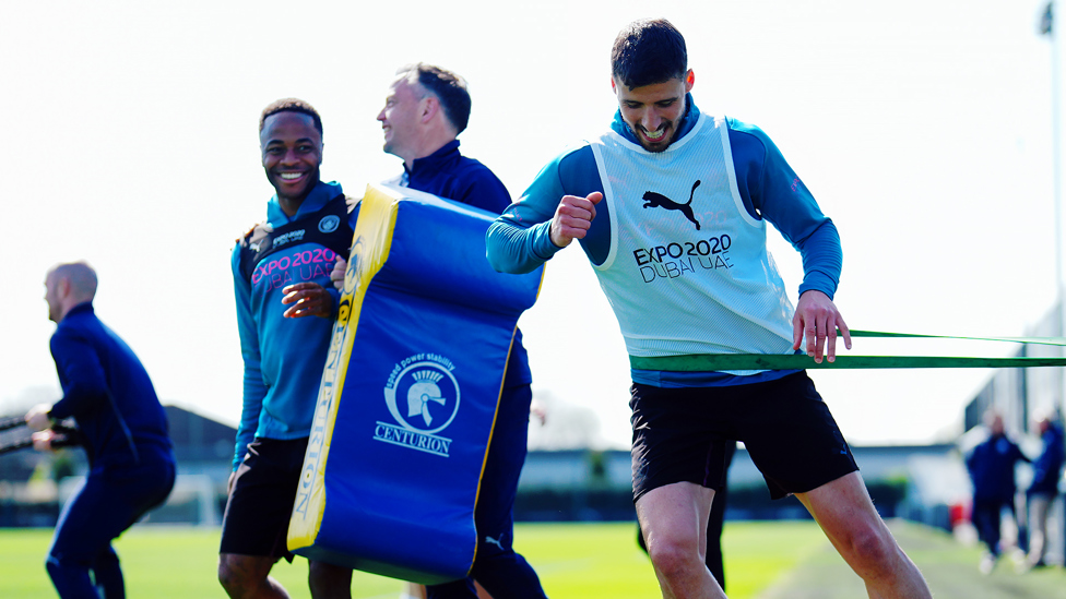 STRETCH : Ruben Dias gets to work after returning from injury against Brighton.