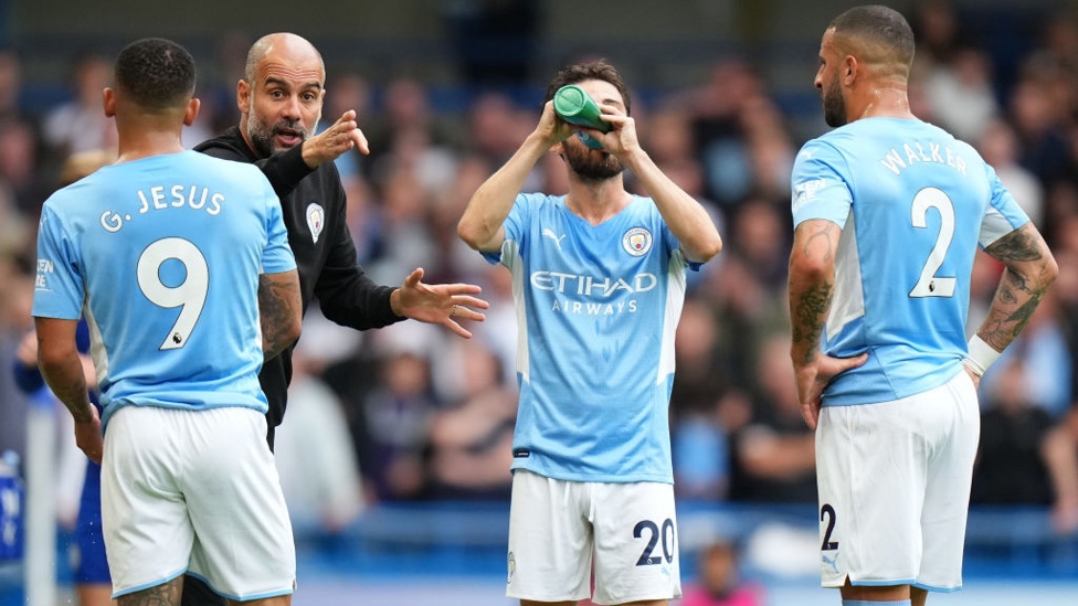 PEP TALK : The boss provides some instructions midway through the first-half.