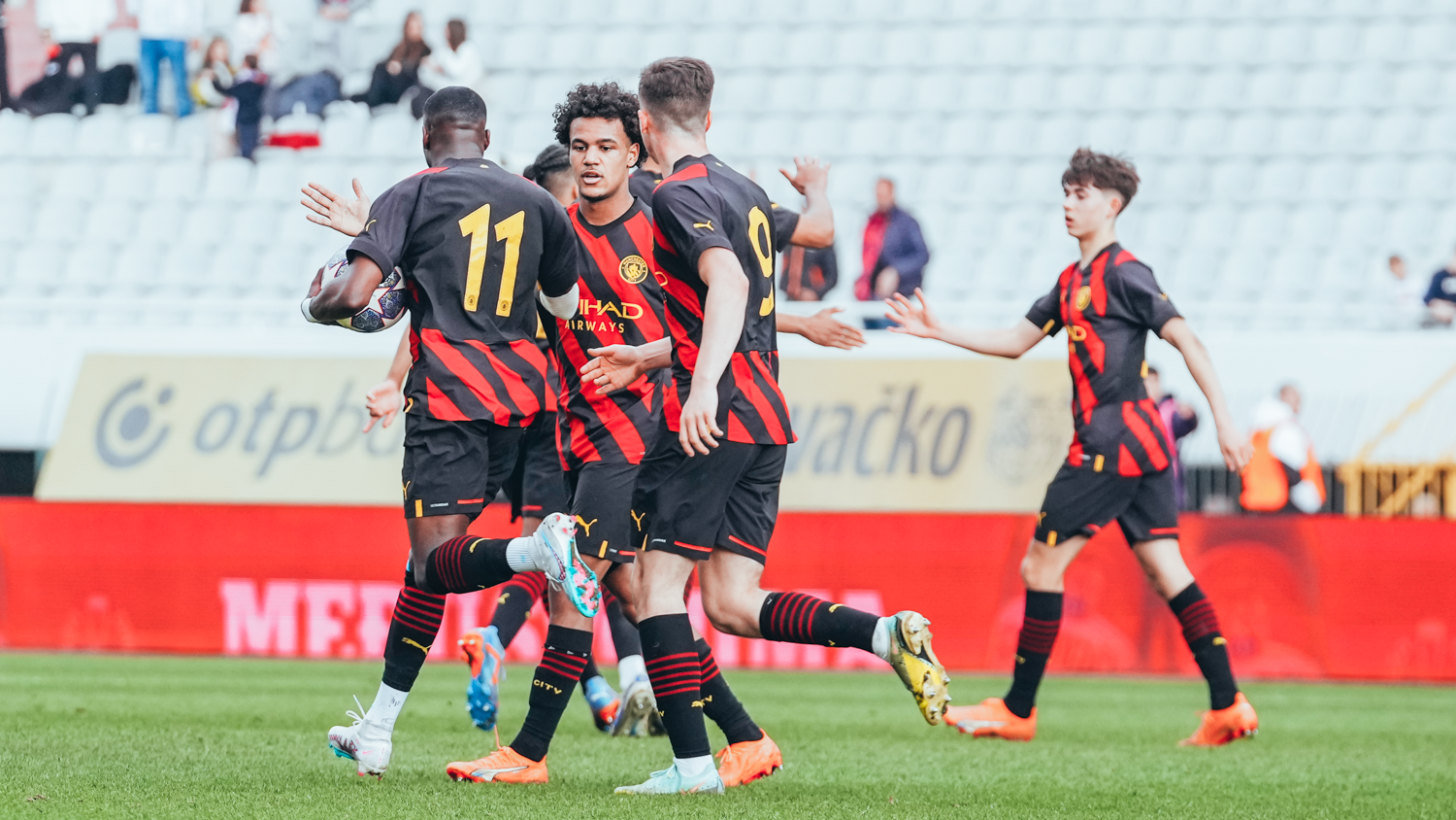 GAME ON: City and Oscar Bobb celebrate after the midfielder's strike