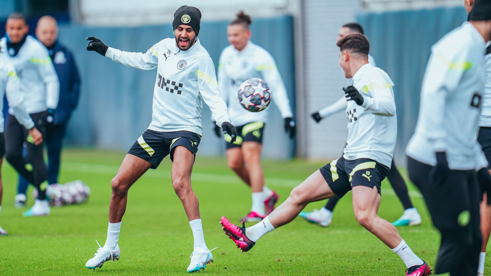 STRIKE A POSE : Mahrez and Julian Alvarez compete for the ball