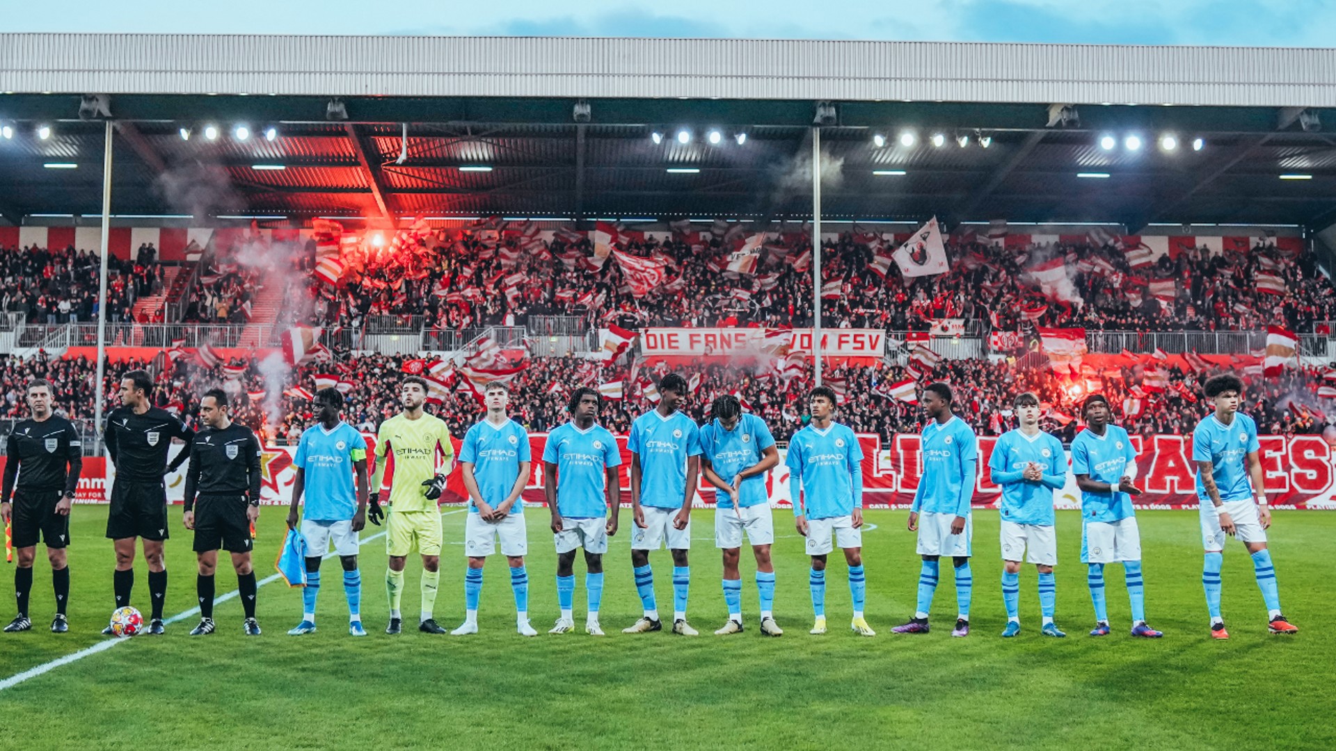 STARTING XI : City's team take to the pitch in front of a colourful crowd. 