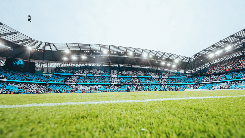 A MOMENT OF TRANQUILITY : Just before the players take to the pitch, fans around the stadium help put on a spectacle. 