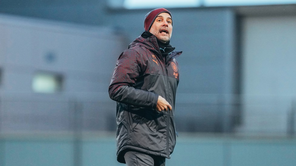 THE BOSS : Pep Guardiola yells some wise words across the CFA. 