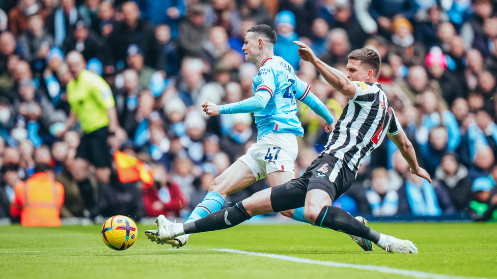 ACTION SHOT: Foden shoots ...