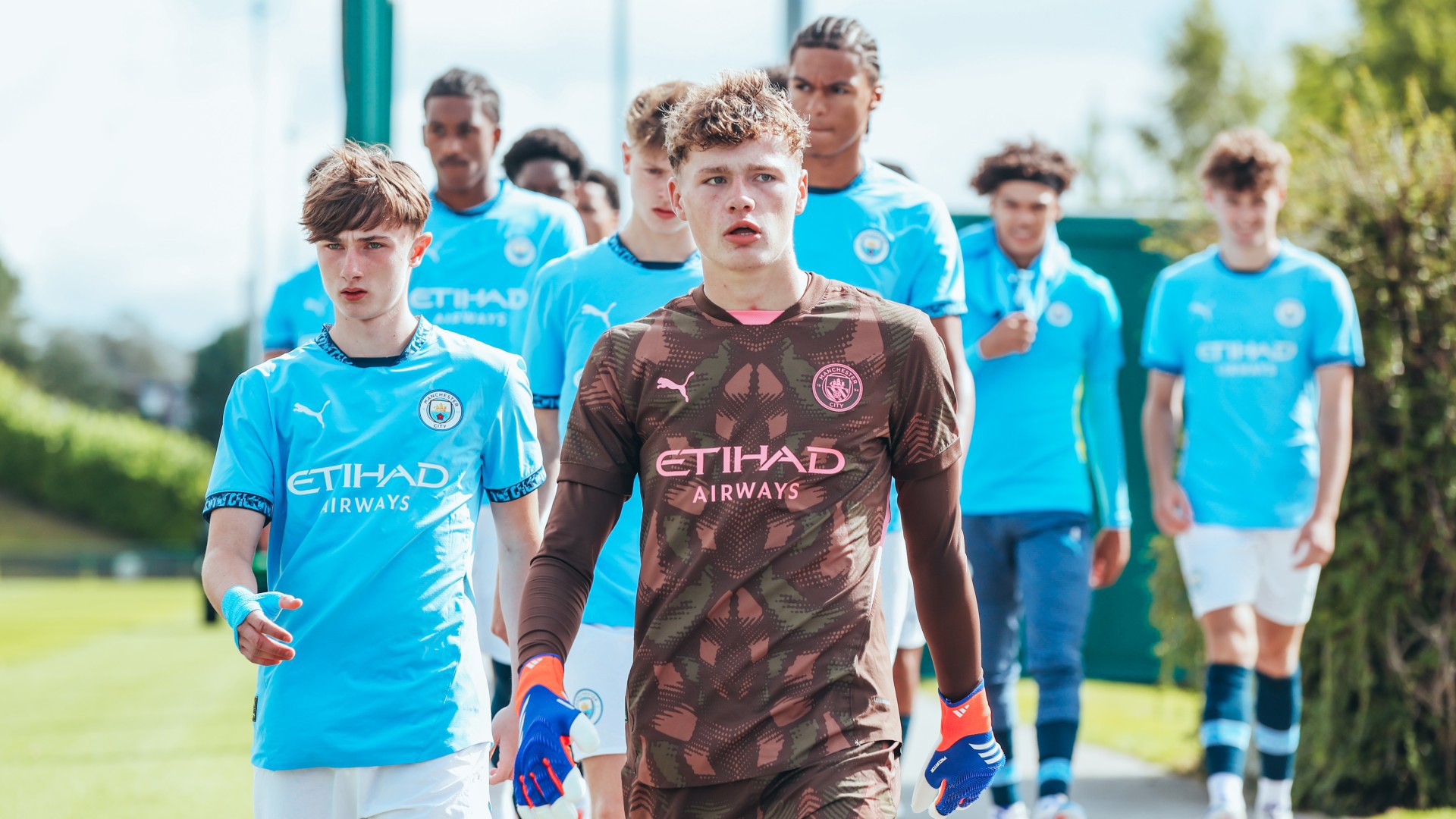 CENTRE STAGE : The Under-18s make their way out on to the pitch.