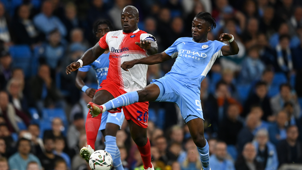 ROMEO V AKINFENWA : Romeo Lavia battles 'the Beast' for the ball.