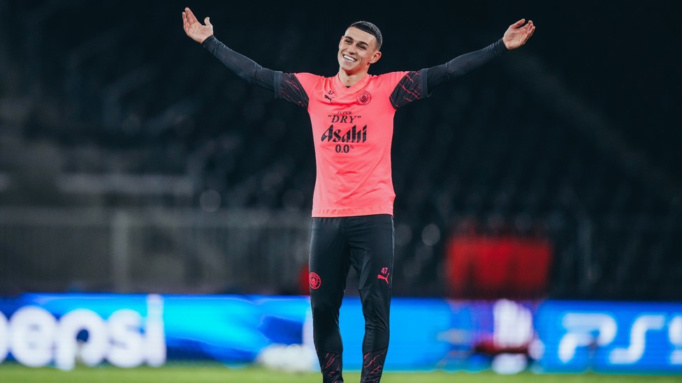 ARMS ALOFT : Phil Foden cracks a smile