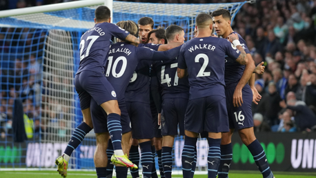 GROUP HUG: The players gather to celebrate Gundogan's goal.