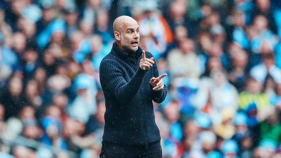 PEPS POINTERS: Pep Guardiola supporting his players to try and breakthrough a stubborn Leeds defence.