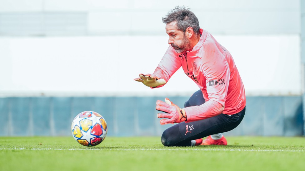 GET LOW : Scott Carson dives to save a shot. 