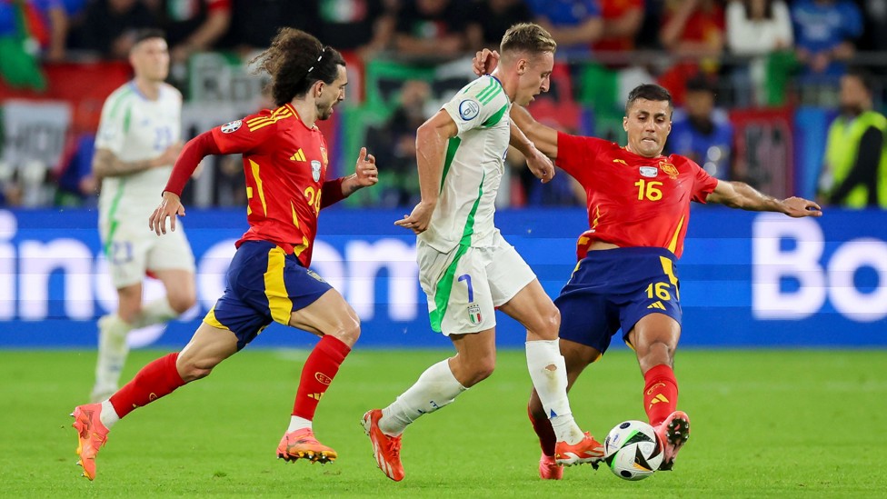 EURO RIVALS : Rodrigo puts in a challenge in the 1-0 win over Italy