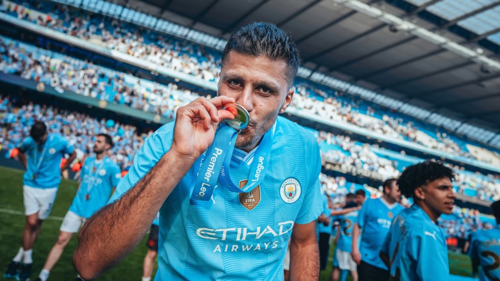 GOLDEN MOMENT : Rodri buzzing on the Etihad pitch after helping City to a fourth successive Premier League crown.