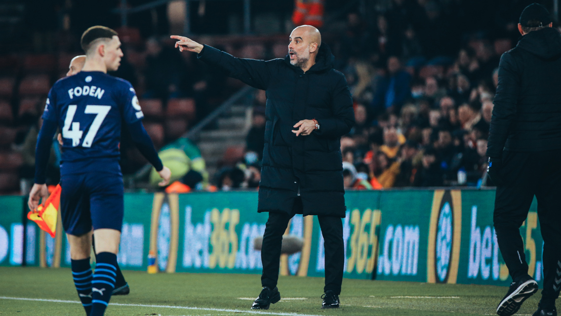 PEP TALK: The boss passes on instructions from the touchline.