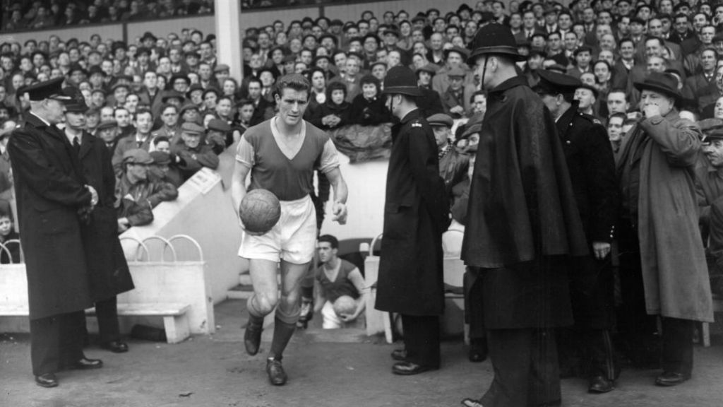 LEADING MAN: Malcolm Allison leads West Ham out in a game from 1956