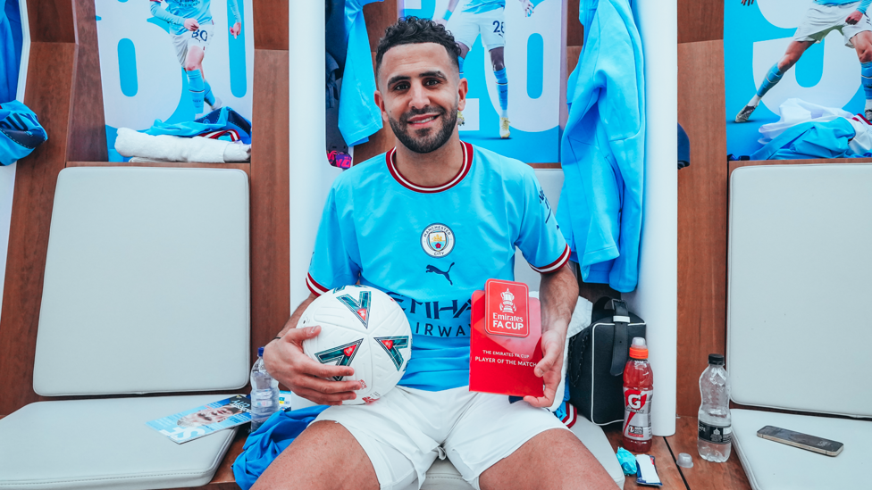 MATCH BALL : Riyad Mahrez smiles with his match ball and MOTM trophy.