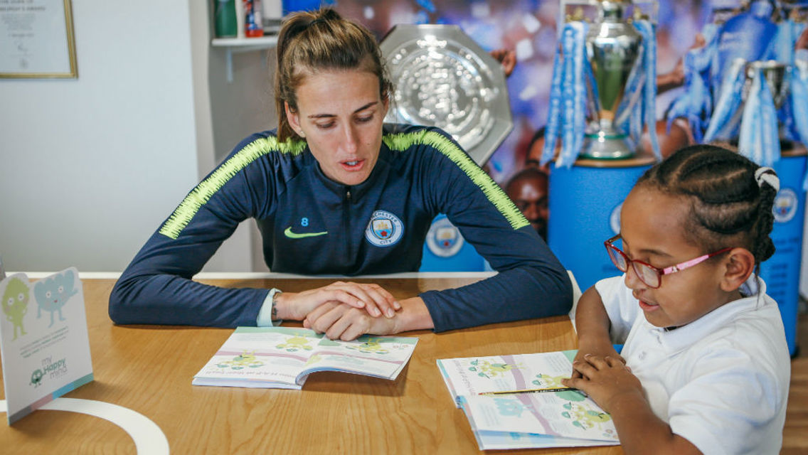 HELPING HAND: Jill Scott works through the myHappymind booklet with a pupil from a local primary school