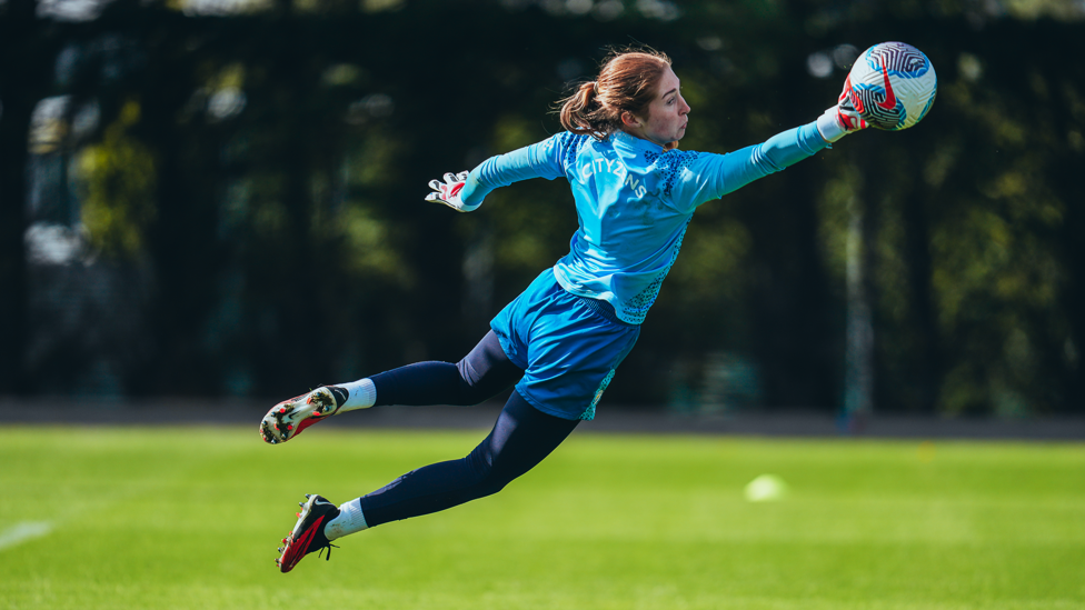 SAFE LIKE SANDY : MacIver makes a diving stop