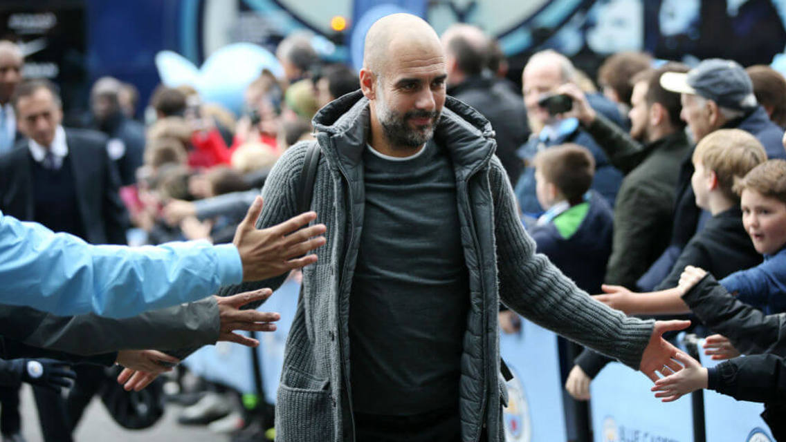 BOSS MAN: Pep arrives at the Etihad to a rapturous reception. 