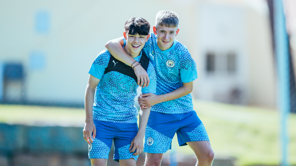 ENJOYING THE SUN : Danny Batty and Seb Naylor spot our photographer and take a quick break to smile for the camera.