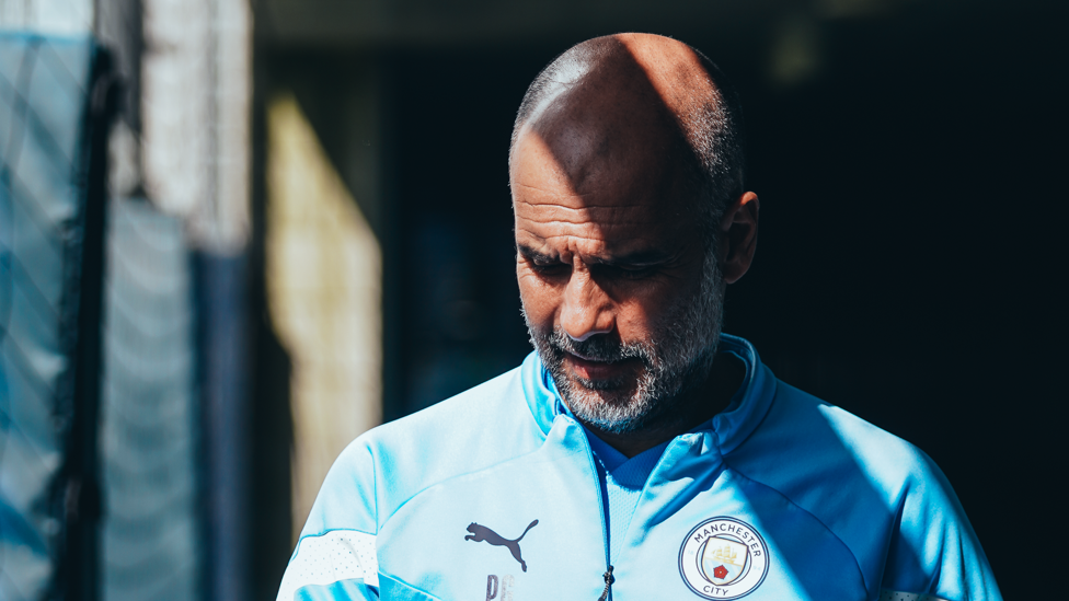 THE BOSS : Pep Guardiola deep in thought as he marches towards another training session