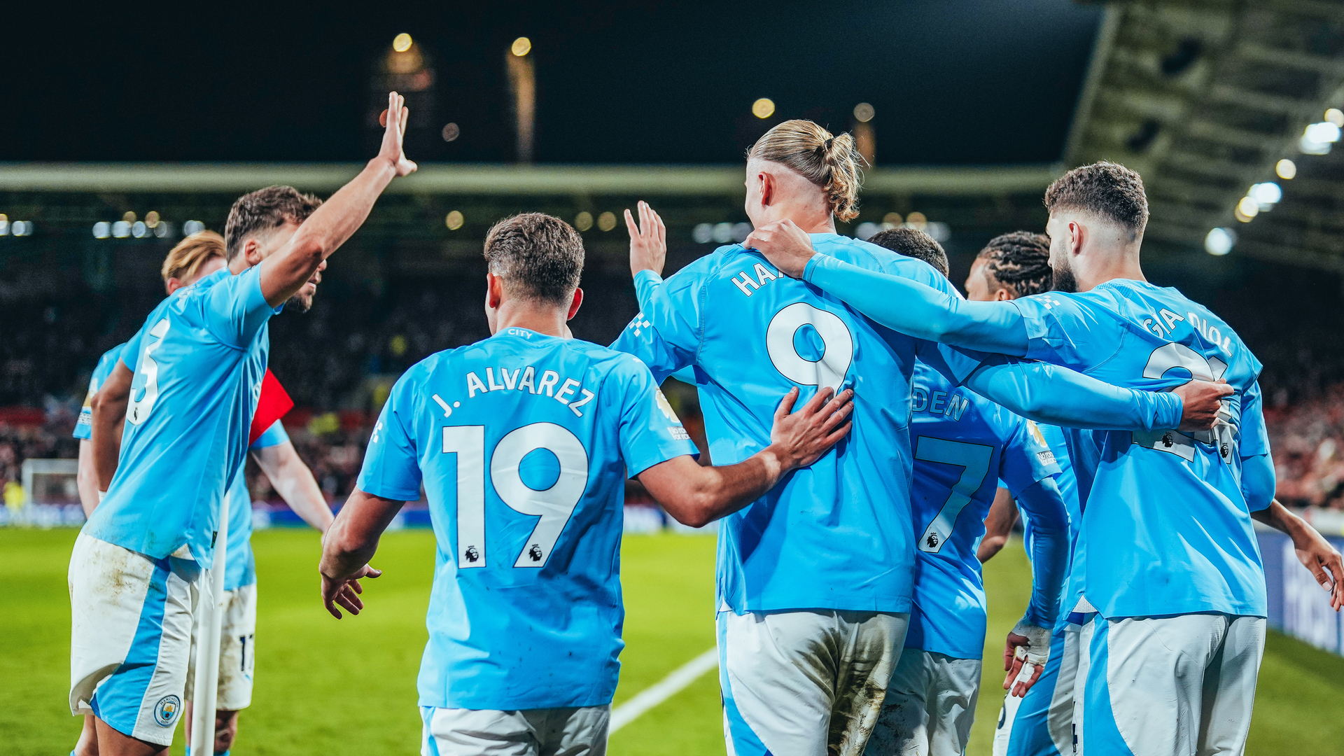 CELEBRATION TIME: The City players salute Phil Foden after his hat-trick