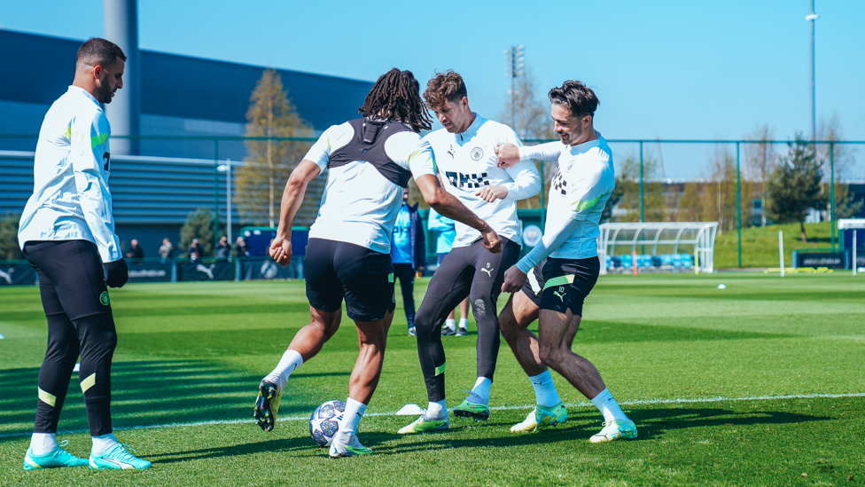 John Stones and Jack Grealish close in on Nathan Ake