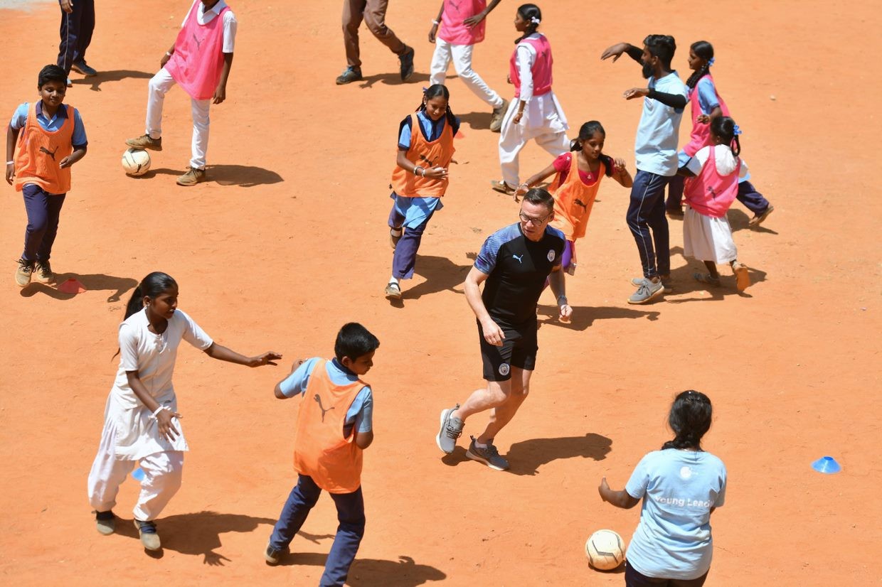 THE POWER OF FOOTBALL: City legend Paul Dickov takes part in a game with some local youngsters