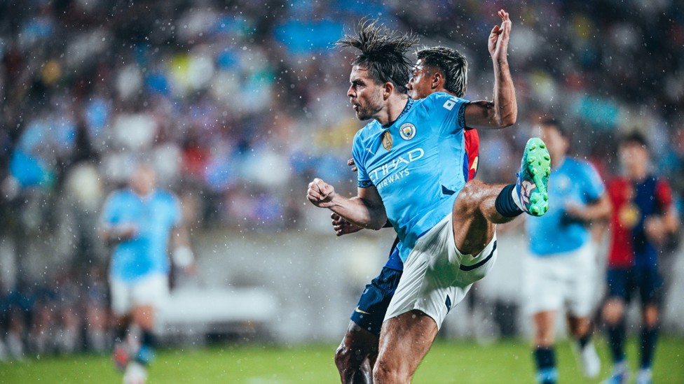 UP HIGH : Jack Grealish fights to win the ball in the air.