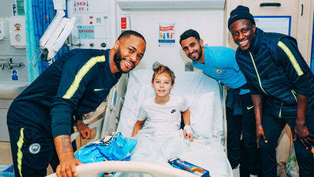 SEASONS GREETINGS: Raheem Sterling, Riyad Mahrez and Benjamin Mendy meet one of the many brave youngsters